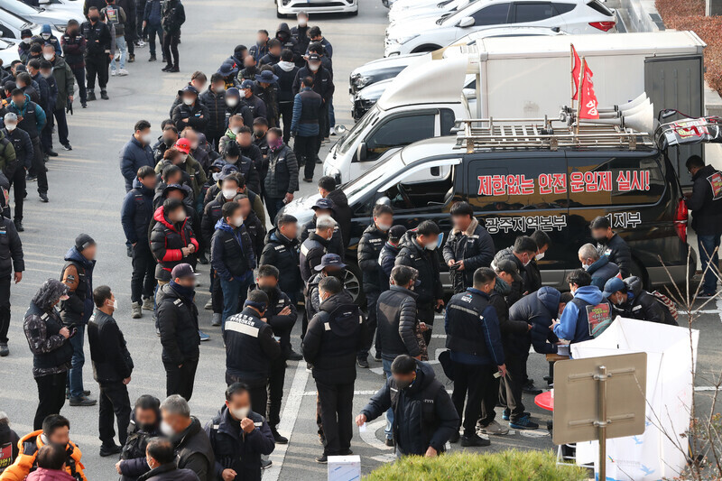 Members of TruckSol wait in line outside the union’s Gwangju headquarters on Dec. 9 to vote on whether to continue their ongoing strike. (Yonhap)