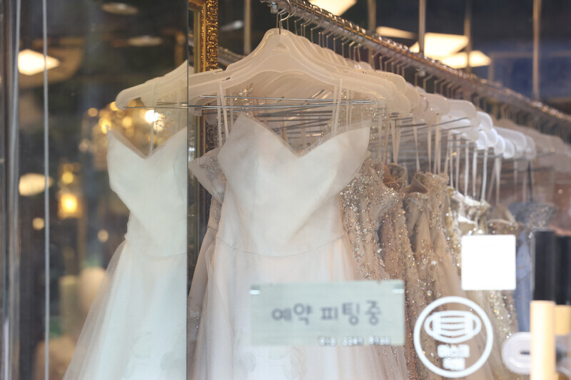 Wedding dresses hang in a boutique in Seoul’s Ahyeon neighborhood in this undated photo. (Yonhap)