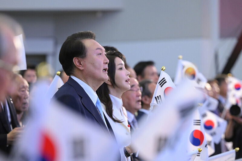 President Yoon Suk-yeol sings along to the official song of National Liberation Day at an event for the occasion on Aug. 15 at Ewha Womans University in Seoul. (presidential office pool photo)