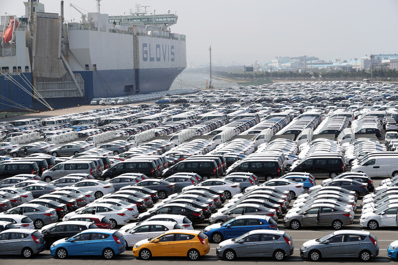 Hyundai cars are lined up on a shipping pier at the Hyundai Motors’ Port waiting to be loaded onto a ship for export.