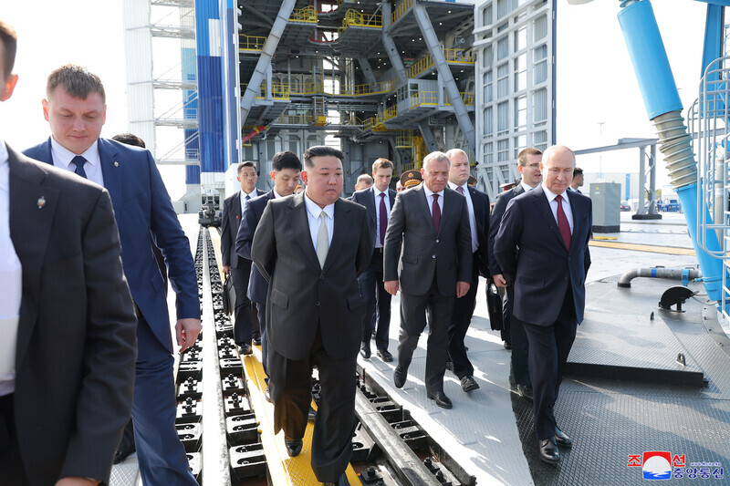 North Korean leader Kim Jong-un walks with Russian President Vladimir Putin around the Vostochny Cosmodrome in Russia’s Far East on Sept. 13. (KCNA/Yonhap)