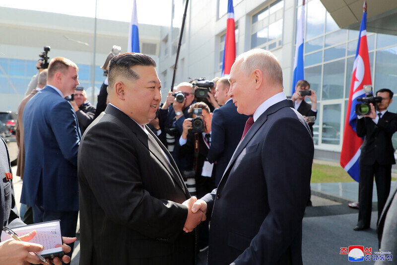 North Korean leader Kim Jong-un shakes hands with Russian President Vladimir Putin upon his arrival at the Vostochny Cosmodrome in Russia’s Far East on Sept. 13. (KCNA/Yonhap)