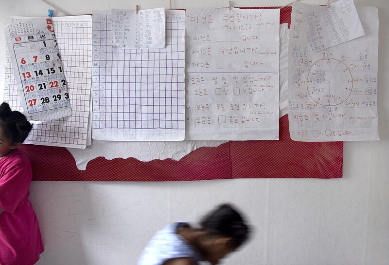 Sheets of paper for studying Korean taped to the walls of the temporary residence of Yemeni asylum seeker Jamal and his family on Jeju Island. (Kang Jae-hoon