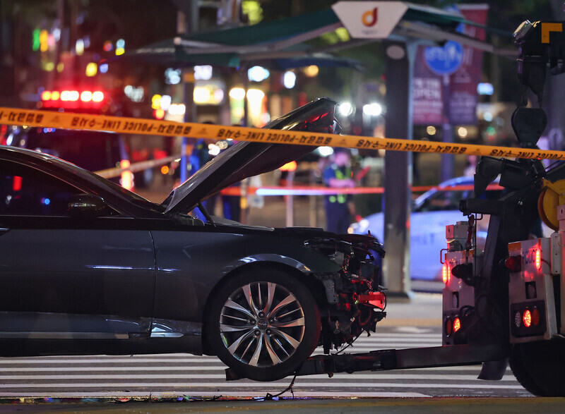 Early on July 2, police cordon off the area around a car that was at the center of a deadly crash on July 1, 2024, near City Hall Station on the Seoul Metro. (Yonhap)