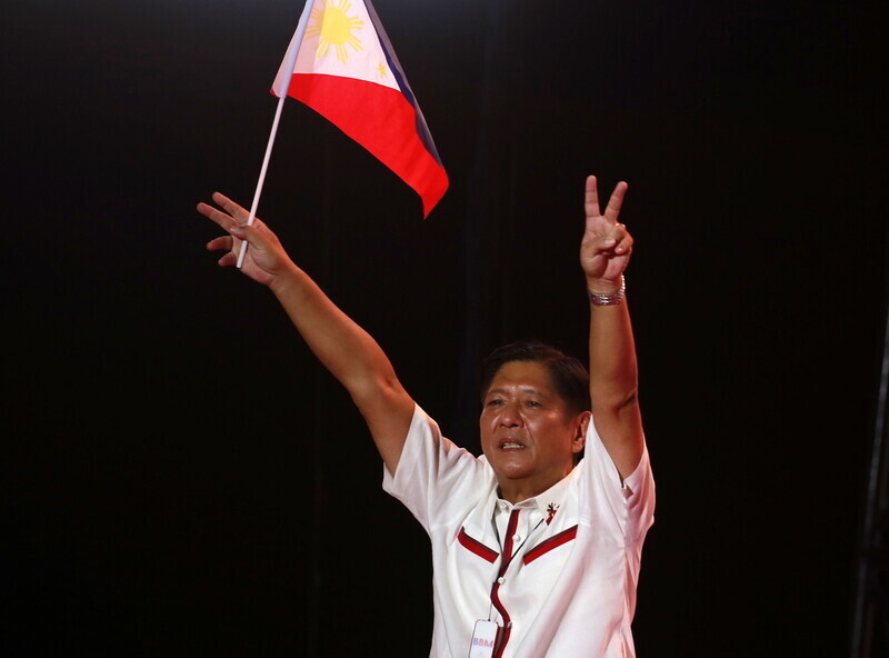 Ferdinand Marcos Jr., the president-elect of the Philippines, gestures to supporters while on the campaign trail on May 7. (EPA/Yonhap News)