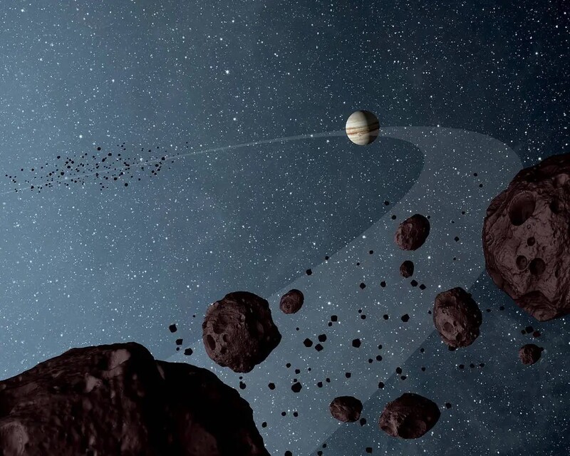 목성의 앞뒤로 짝을 이뤄 태양을 공전하는 트로이 소행성군(상상도). 나사 제공