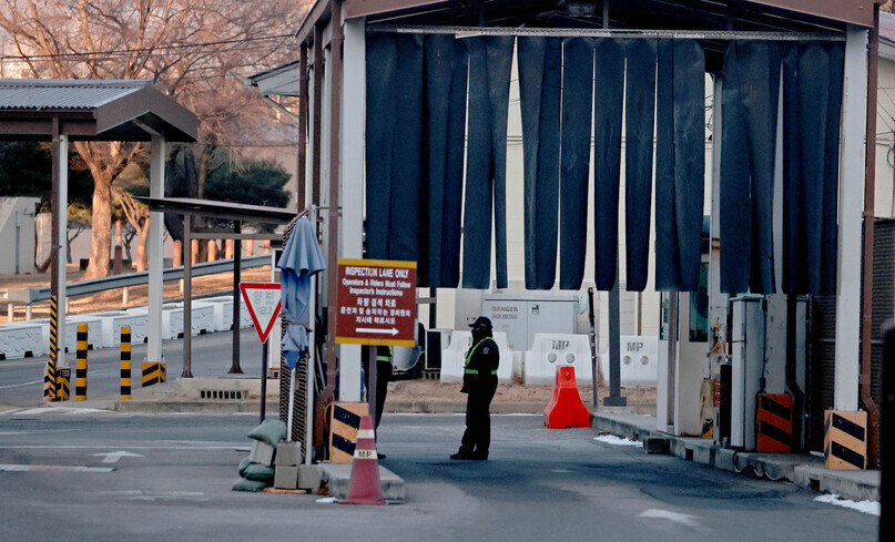 A person stands at the entrance to the Yongsan Garrison in Seoul on Friday afternoon. (Yonhap News)