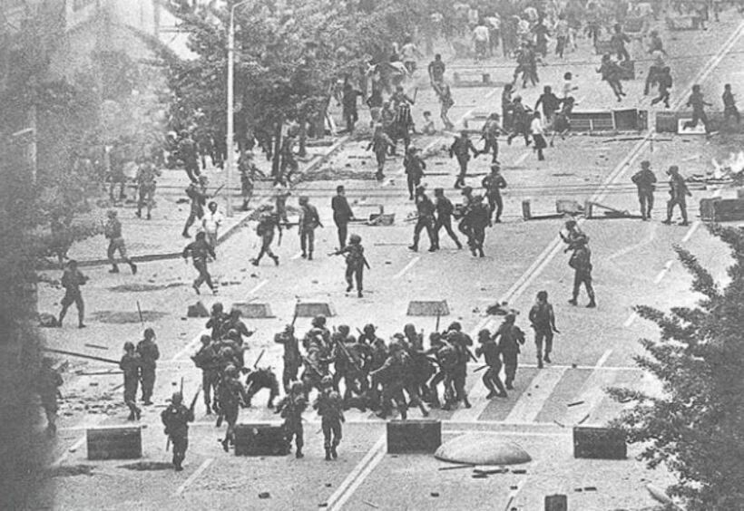Martial law troops brutally suppress the Gwangju Democratization Movement of 1980.