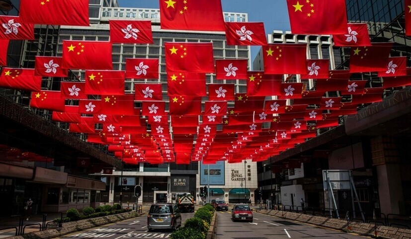 Chinese national flags fly alongside Hong Kong flags on Sept. 30, 2021, ahead of China’s National Day on Oct. 1. (AFP/Yonhap)