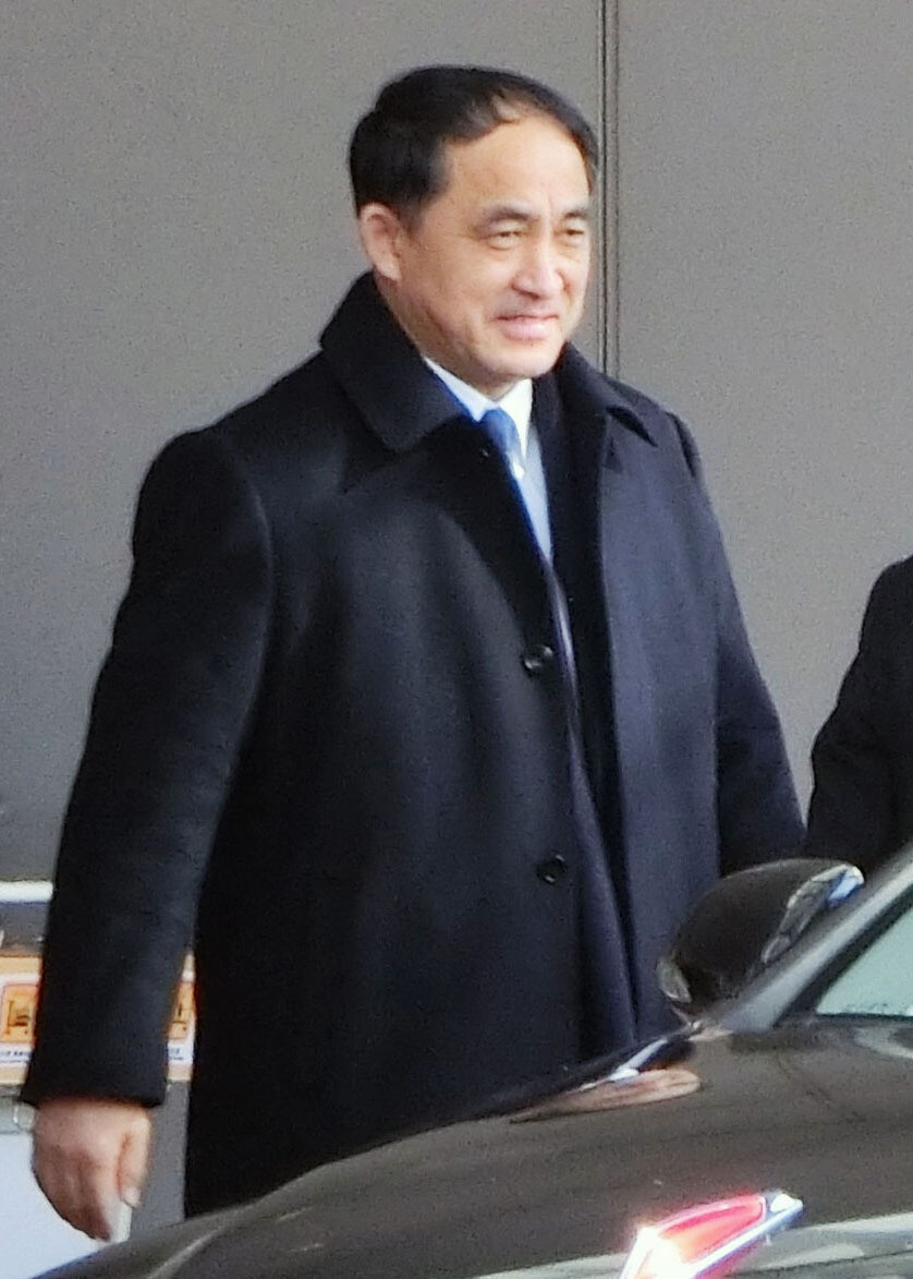 North Korean Vice Minister Ri Kil-song gets into a car after arriving at Beijing Capital International Airport