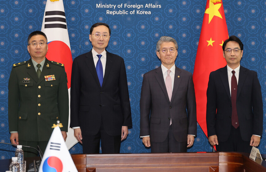 South Korea’s First Vice Foreign Minister Kim Hong-kyun (second from right) and his Chinese counterpart, Sun Weidong (second from left), pose for a photo during their talks in Seoul on June 18, 2024. With them are Lee Seung-buhm (right), director general for international policy at the Defense Ministry, and Zhang Baoqun (left), deputy director of the Office of International Military Cooperation of China's Central Military Commission. (Yonhap)