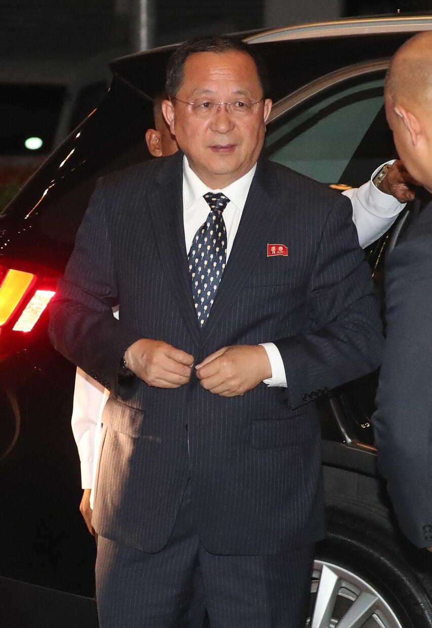 North Korean Foreign Minister Ri Yong-ho walks past reporters at a meeting of the ASEAN Regional Forum in Manila