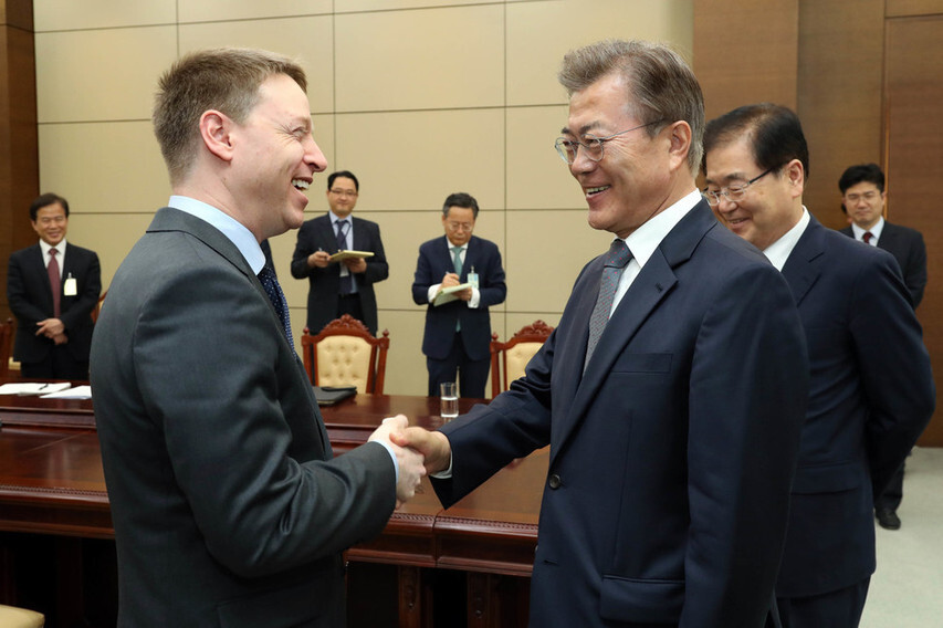 President Moon Jae-in shakes hands with Matthew Pottinger