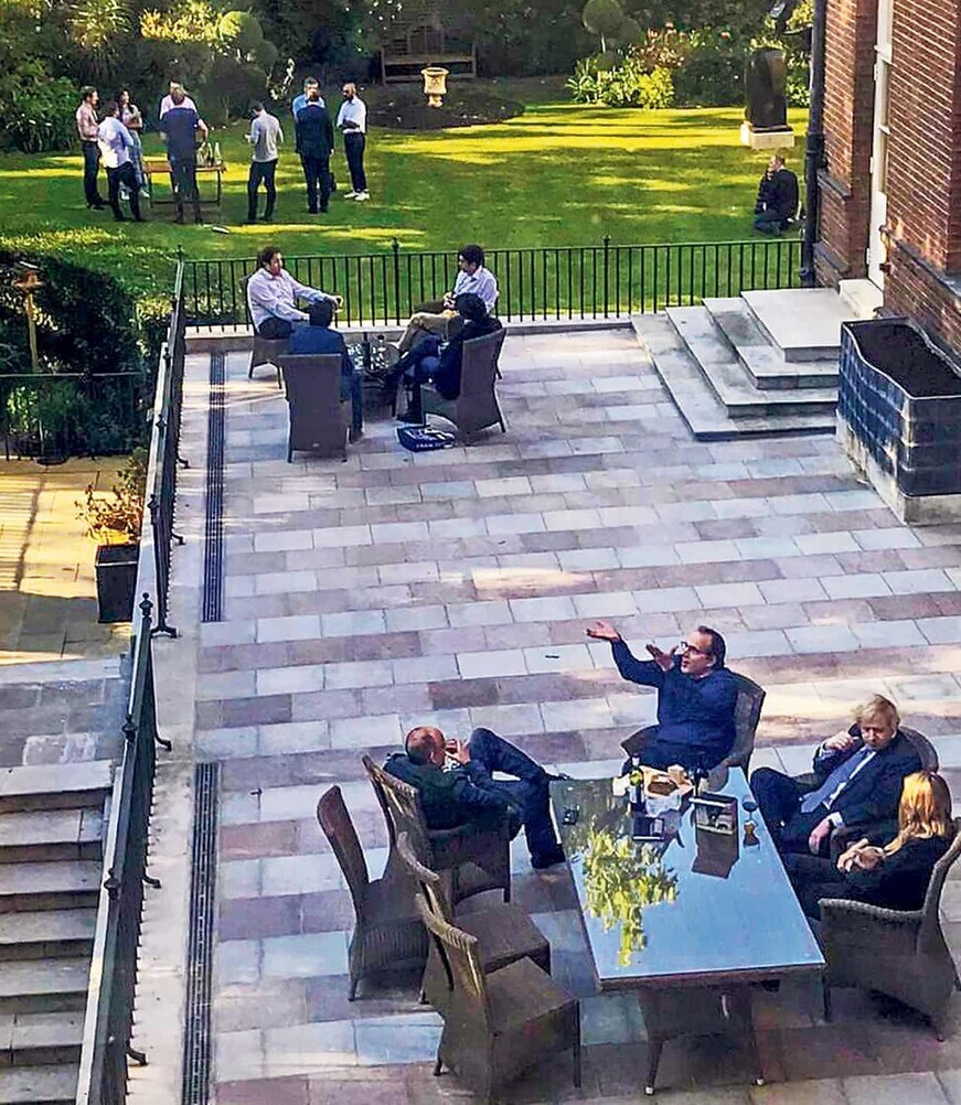 The Guardian released this photo of UK Prime Minister Boris Johnson (second from right) drinking with others at the official Downing Street residence. (The Guardian)