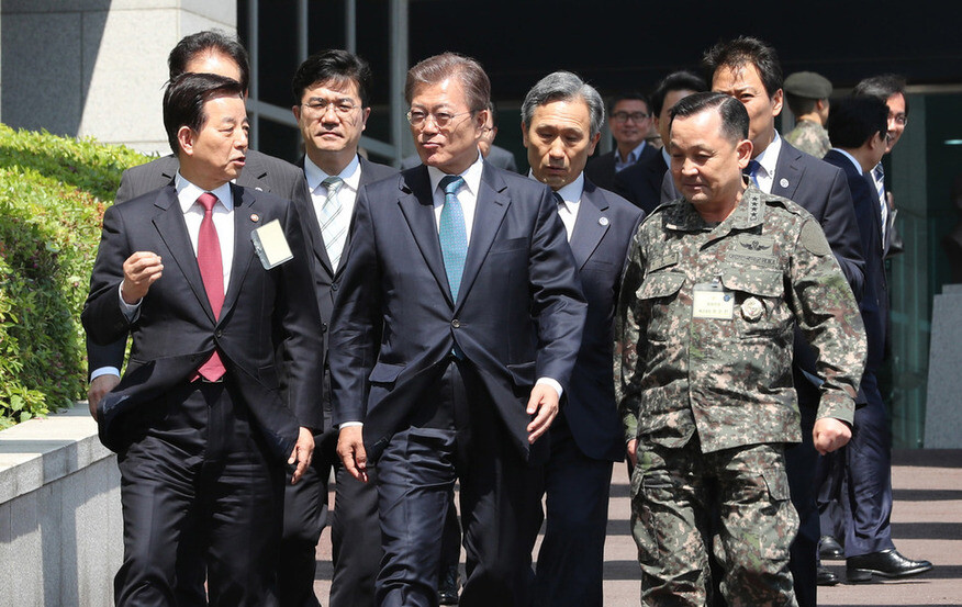 President Moon Jae-in moves to the Joint Chiefs of Staff headquarters after leaving a meeting at the Ministry of National Defense in Seoul