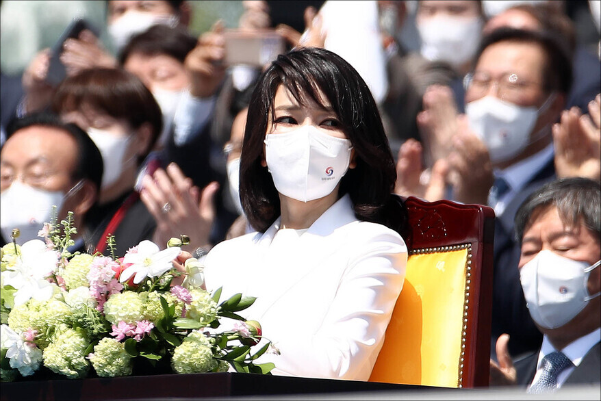 Kim Keon-hee, the wife of President Yoon Suk-yeol, applauds during the inauguration ceremony on May 10. (National Assembly pool photo)