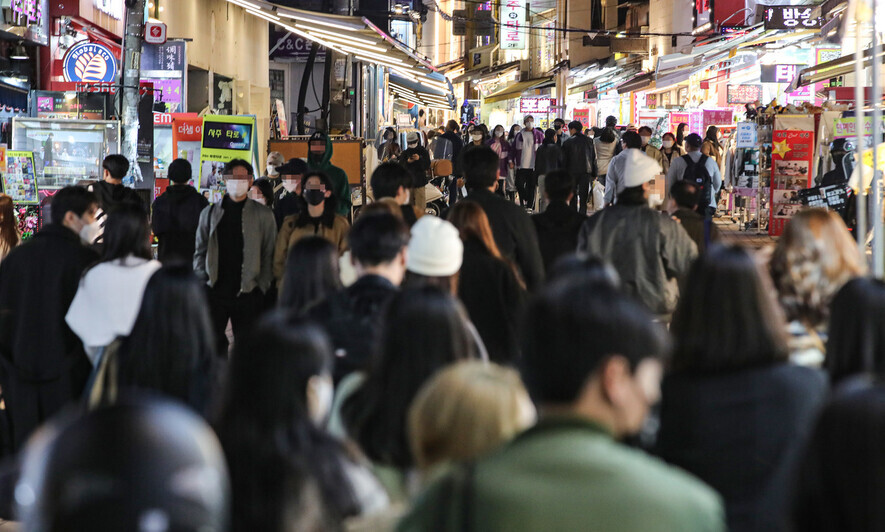 People walk through the Hongdae area of Seoul. (Yonhap)