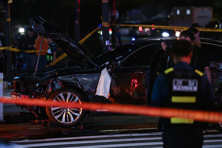 Police cordon off the area around a car that was at the center of a deadly crash on July 1, 2024, near City Hall Station on the Seoul Metro. (Yonhap)