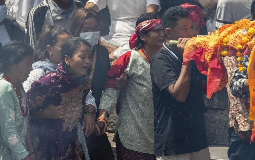 A funeral service held at the Pashupati crematorium in Kathmandu, Nepal, for family members missing after a massive flash flood on Aug. 26, 2026. (EPA/Yonhap)
