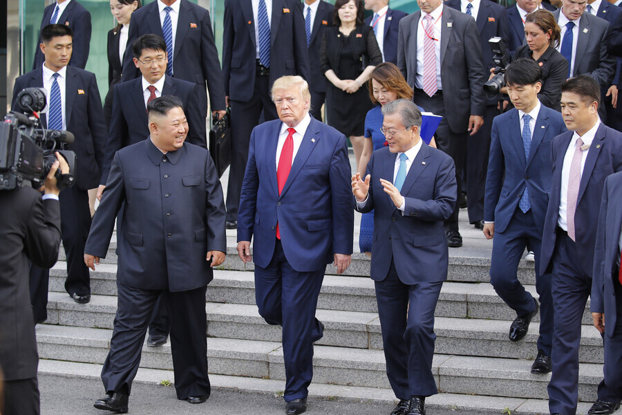 North Korean leader Kim Jong-un, US President Donald Trump, and South Korean President Moon Jae-in at their surprise summit in Panmunjom on June 30. (Kim Jung-hyo, staff photographer)