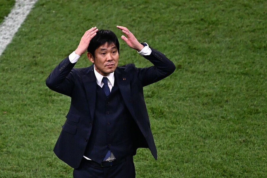 Hajime Moriyasu, head coach of Japan’s national football team, celebrates after having bested the German national team in Japan’s first match of the 2022 FIFA World Cup in Doha, Qatar, on Nov. 23. (AFP/Yonhap)