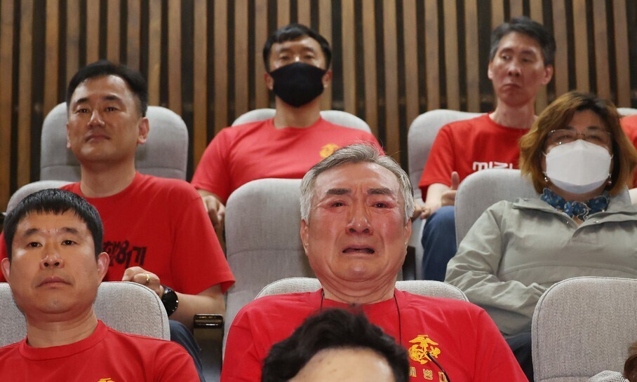 A Marine Corps reservist in the National Assembly gallery on May 2, 2024, watches with tears in his eyes as lawmakers pass a special act to assign a special counsel to probe alleged efforts to cover up an internal investigation into the death of a Marine carrying out flood rescue efforts in July 2023. (Yonhap)