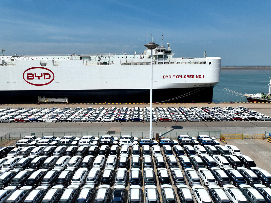 Electric vehicles produced by Chinese auto giant BYD wait in a port in Lianyungang, China, to be loaded onto a freight ship for export to Brazil on April 25, 2024. (Reuters/Yonhap)