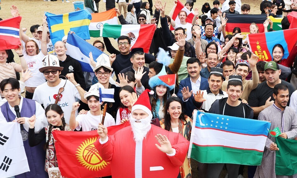 International students at Ajou University in Suwon, Gyeonggi Province, celebrate Ajou International Day on Nov. 9, 2023. (Yonhap)