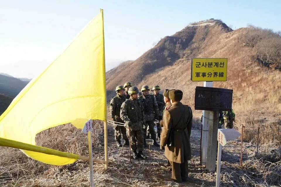 Soldiers from North and South Korea verify the removal of guard posts on each side of the Demilitarized Zone on Dec. 12, 2018, as part of a buffer-creating inter-Korean military agreement. (via Presidential Archives)