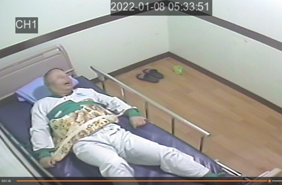 Still from CCTV footage showing a patient at a psychiatric hospital in Chuncheon, South Korea, as he looks toward the door the nurse just left through shortly before his death. 