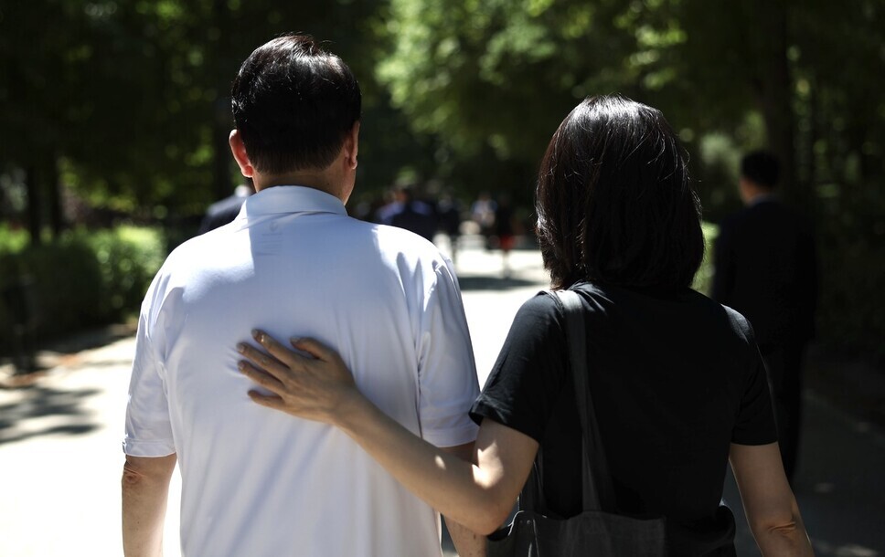 President Yoon Suk-yeol and first lady Kim Keon-hee take a walk near their lodgings in Madrid for the NATO summit in July of 2022. (courtesy of the presidential office)