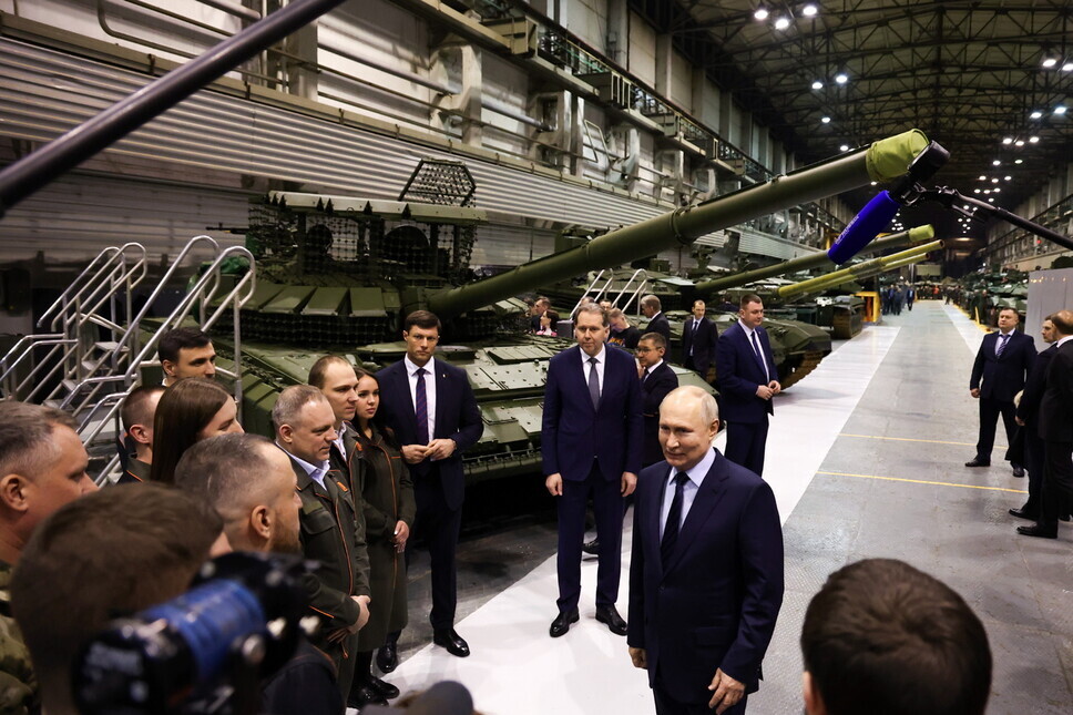 Russian President Vladimir Putin tours a military plant in Nizhny Tagil on Feb. 15, 2024. (TASS/Yonhap)