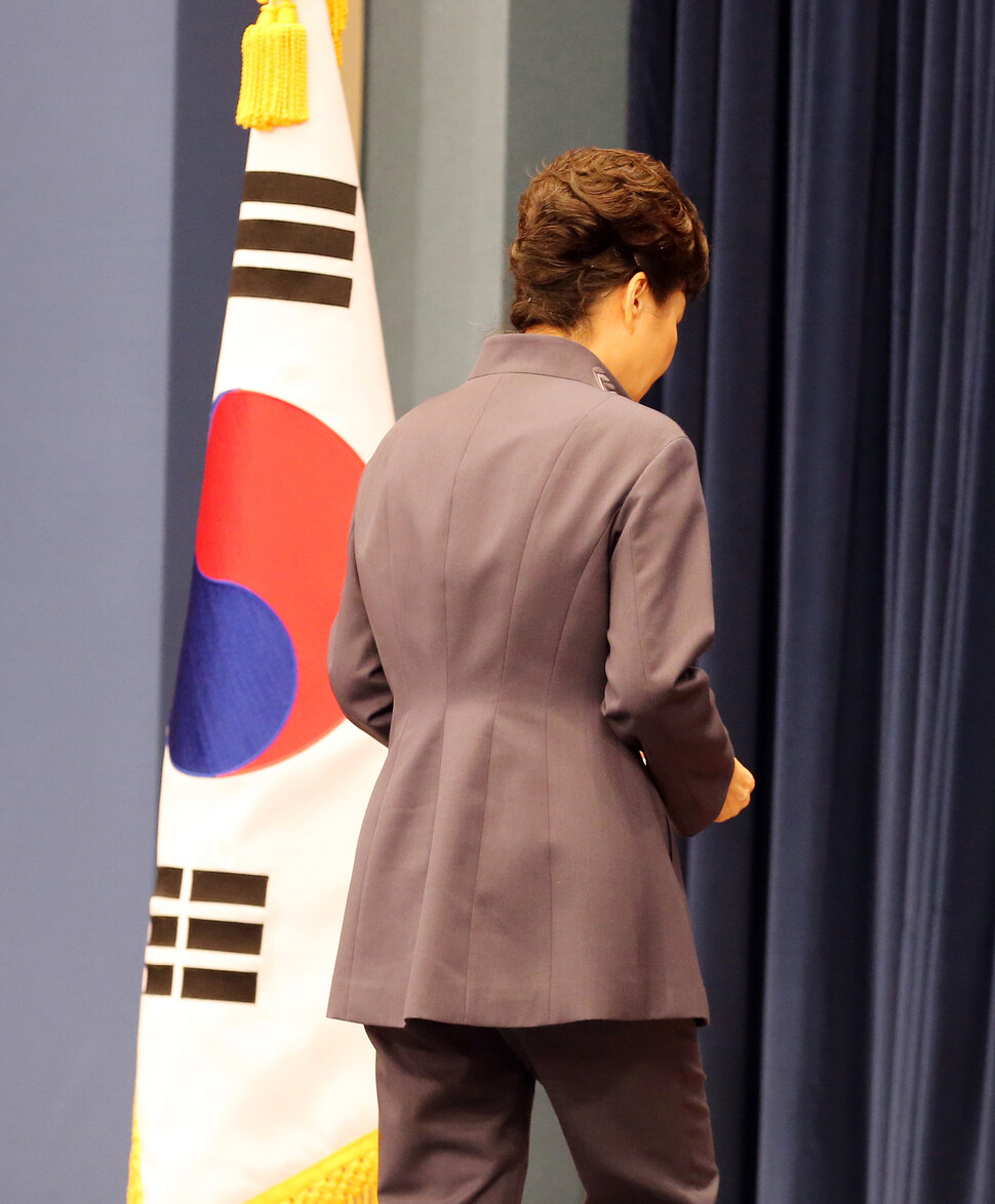 President Park Geun-hye exits after a press conference where she made a public apology for the Choi Sun-sil scandal