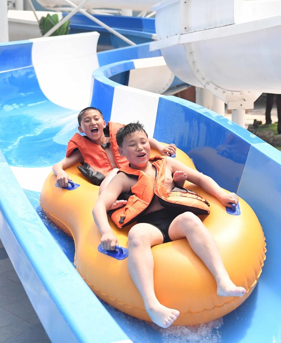 Children on a water slide in Pyongyang’s Munsu Water Park in July 2017