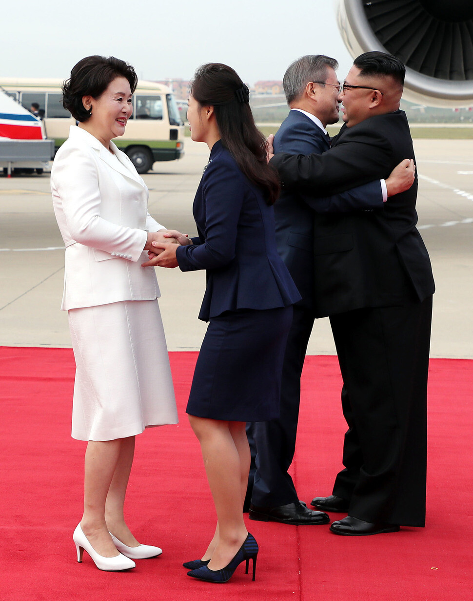 South Korean President Moon Jae-in and first lady Kim Jung-sook are greeted by North Korean leader Kim Jong-un and first lady Ri Sol-ju upon the formers’ arrival at Pyongyang Sunan International Airport on Sept. 18. (photo pool))