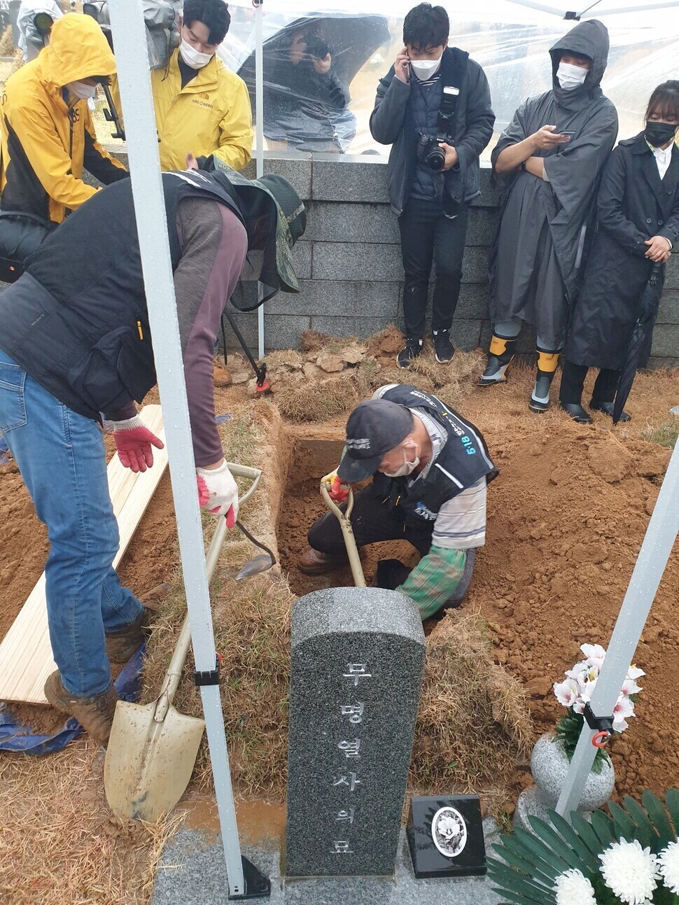 An investigator from the May 18 Democratization Movement Truth Commission exhumes the remains of a child buried in the 