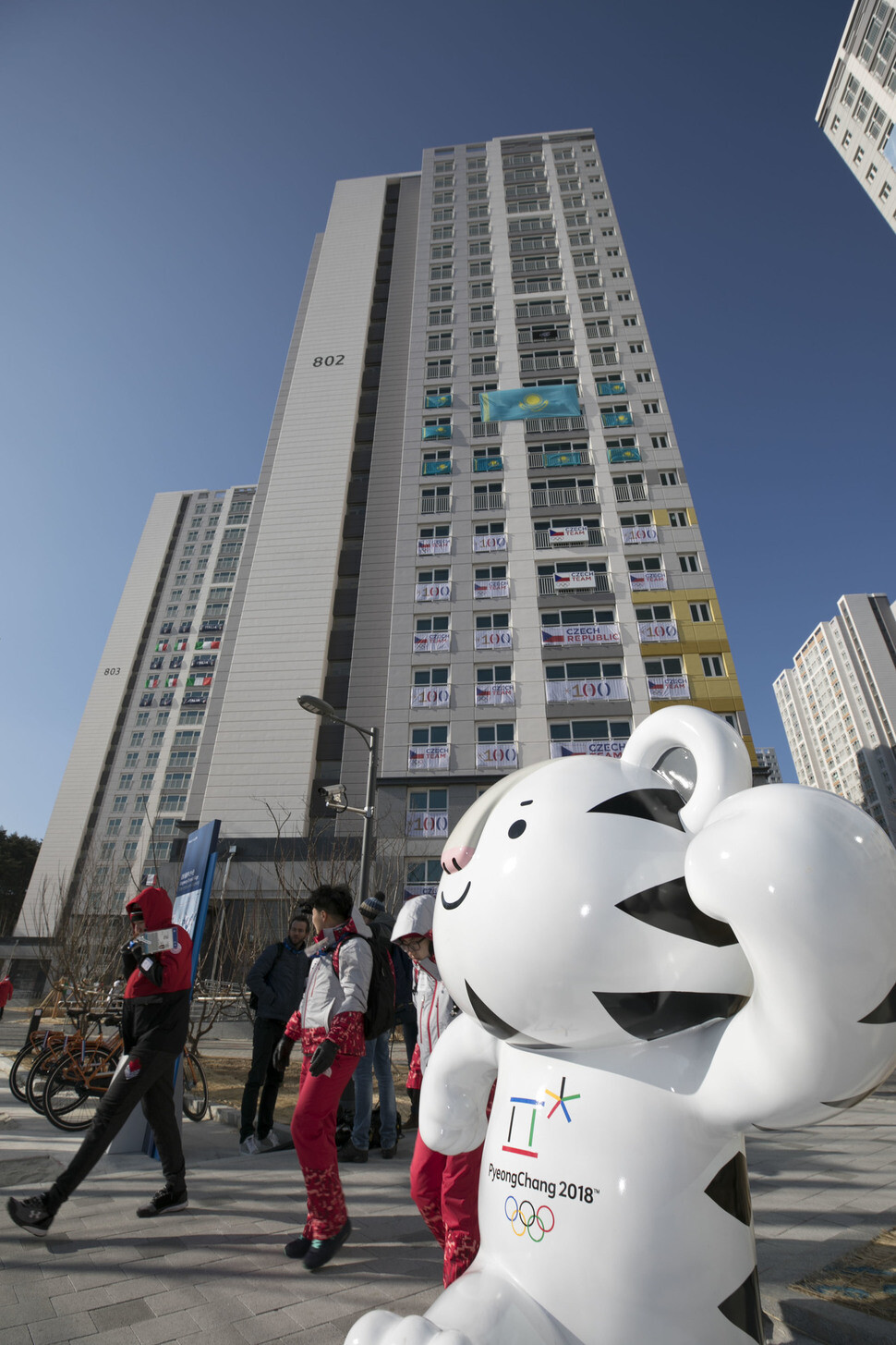 The Olympic mascot Soohorang greets tour visitors at the entrance of the Gangneung Olympic Athletes’ Village on Feb 6. (by Kim Seong-gwang