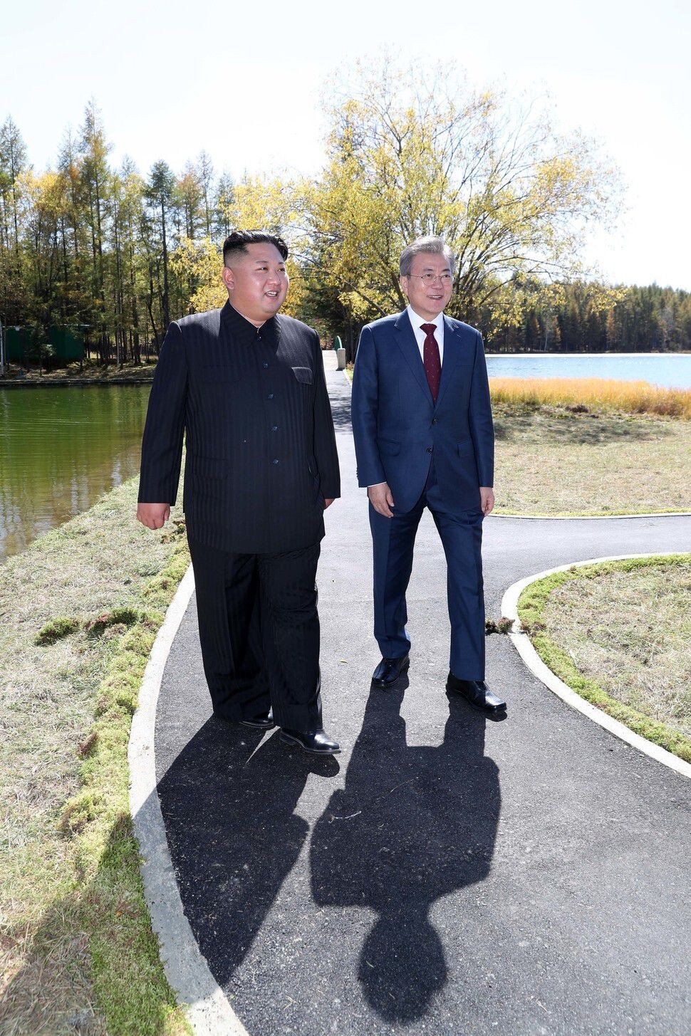 South Korean President Moon Jae-in and North Korean leader Kim Jong-un take a walk around the Samjiyon guest house