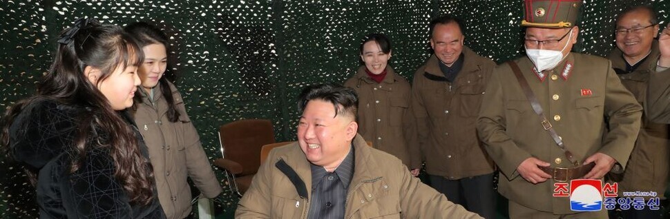 State media on April 13 released this photo of Kim Jong-un, the leader of North Korea, as he “guided the first test-fire of the new-type ICBM” it called the Hwasong-18. His daughter, Kim Ju-ae (left), and wife Ri Sol-ju (second from left), as well as sister Kim Yo-jong (fourth from left) were present at the launch, according to the Rodong Sinmun. (KCNA/Yonhap)