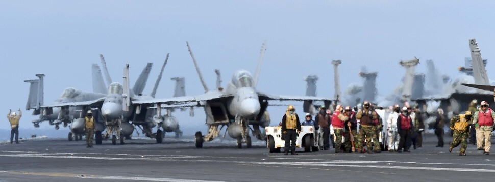 US FA-18 fighter jets from the aircraft carrier USS Carl Vinson prepare for takeoff as part of the Key Resolve-Foal Eagle joint military exercises on Mar. 14. (Photo Pool)