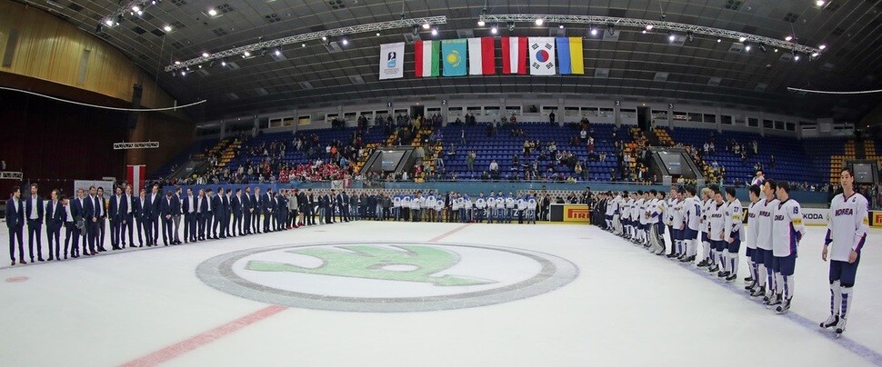South Korean men’s national ice hockey team players participate in the awards ceremony at the International Ice Hockey Federation (IIHF) World Championship Division I Group A tournament in Kiev