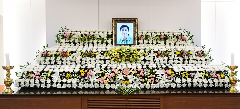 A funeral portrait of actor Lee Sun-kyun sits among flowers at his wake, held at the funeral hall of Seoul National University Hospital. (pool photo)