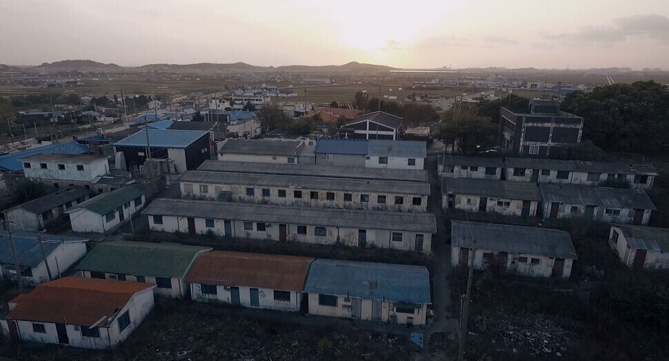 America Town, a neighborhood near the US air base in Gunsan, as seen in 2014 in the documentary film “Host Nation,” by Lee Ko-woon. (courtesy of Lee Ko-woon)