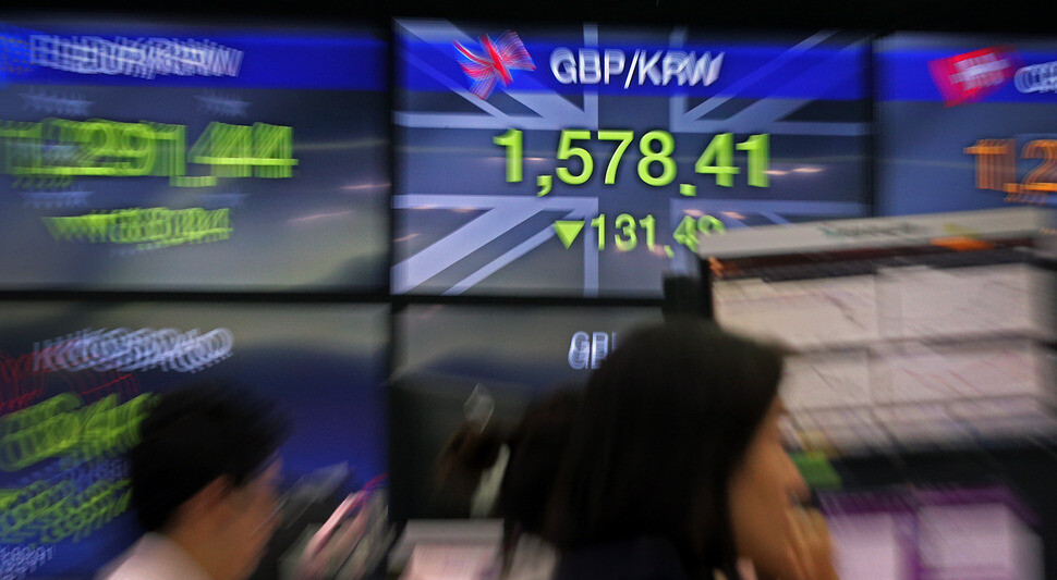 A monitor showing the South Korean won-British pound exchange rate at KEB Hana Bank’s trading room in Seoul on June 24