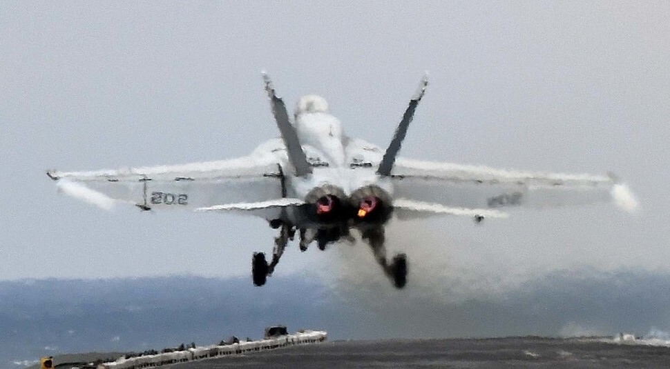 A US F/A 18 fighter jet takes off from the USS Carl Vinson aircraft carrier during South Korea-US joint Key Resolve military exercises in March. (pool photo)