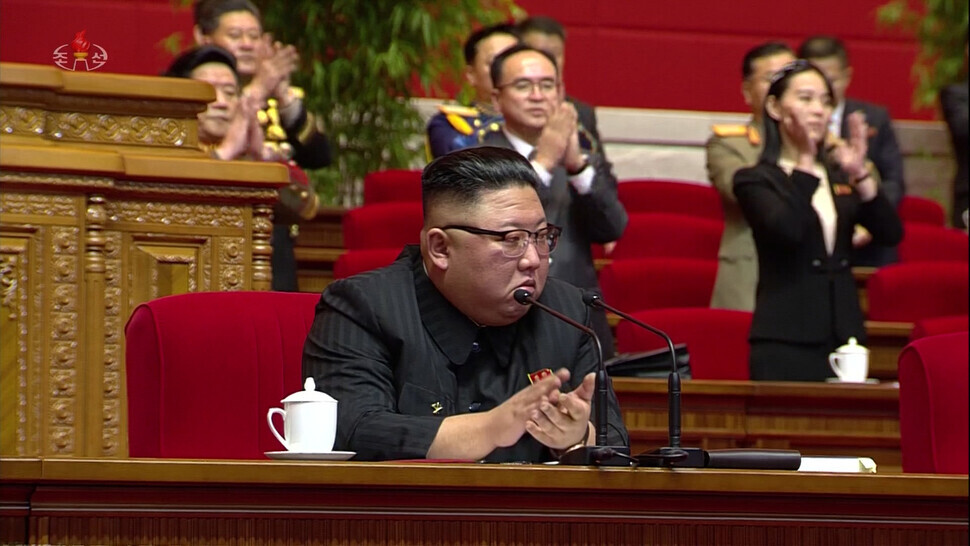 This screenshot from the Korean Central News Agency broadcast shows North Korean leader Kim Jong-un during the eighth Congress of the Workers’ Party of Korea in January 2021. His sister Kim Yo-jong can be seen in the background. (Yonhap News)