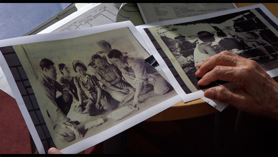 Still from “Koko Sunyi” showing photos from a report on the interrogation of Japanese POWs by Allied forces. (courtesy Connect Pictures)