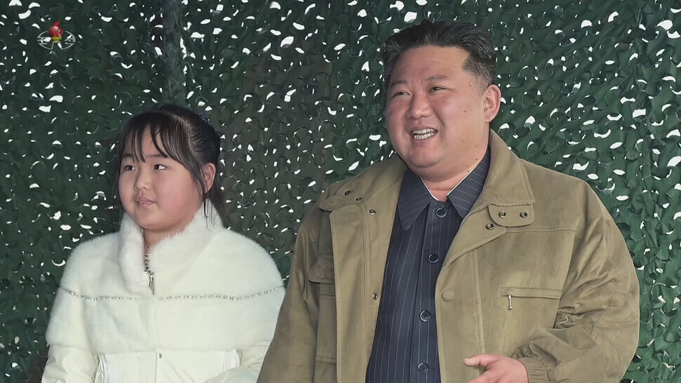 North Korea’s state-run Korean Central Television reported on Nov. 20 that the country had test-fired a “new-type” Hwasong-17 ICBM under the direction of leader Kim Jong-un on Nov. 18. This photo, a still from KCTV, shows Kim with his daughter. (KCTV/Yonhap)