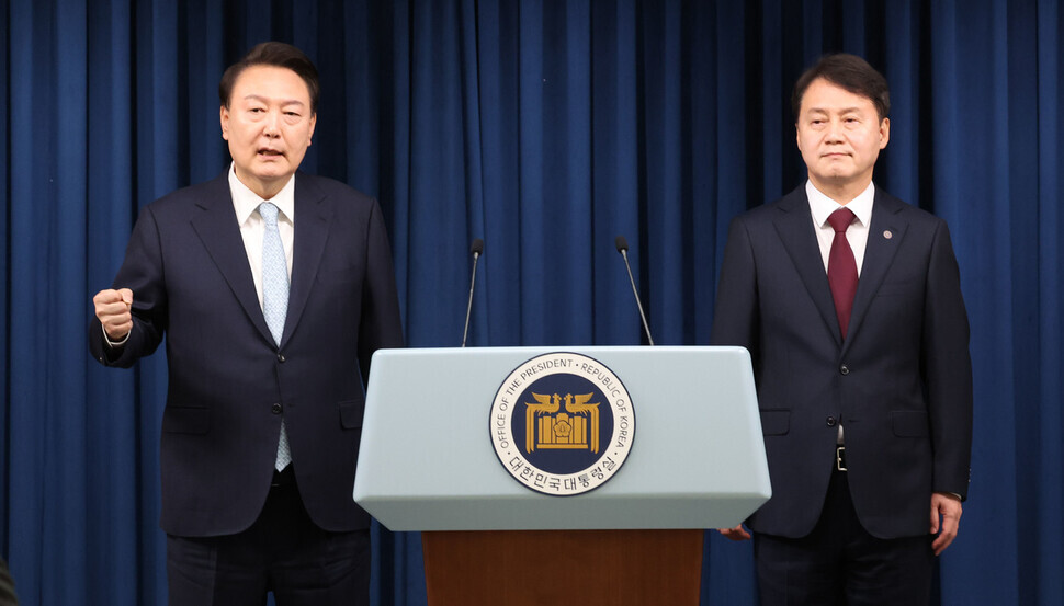 President Yoon Suk-yeol (left) answers questions from reporters after introducing his new senior secretary for civil affairs, former Ministry of Justice Vice Minister Kim Joo-hyun at the presidential office in Seoul on May 7, 2024. (Yonhap) 