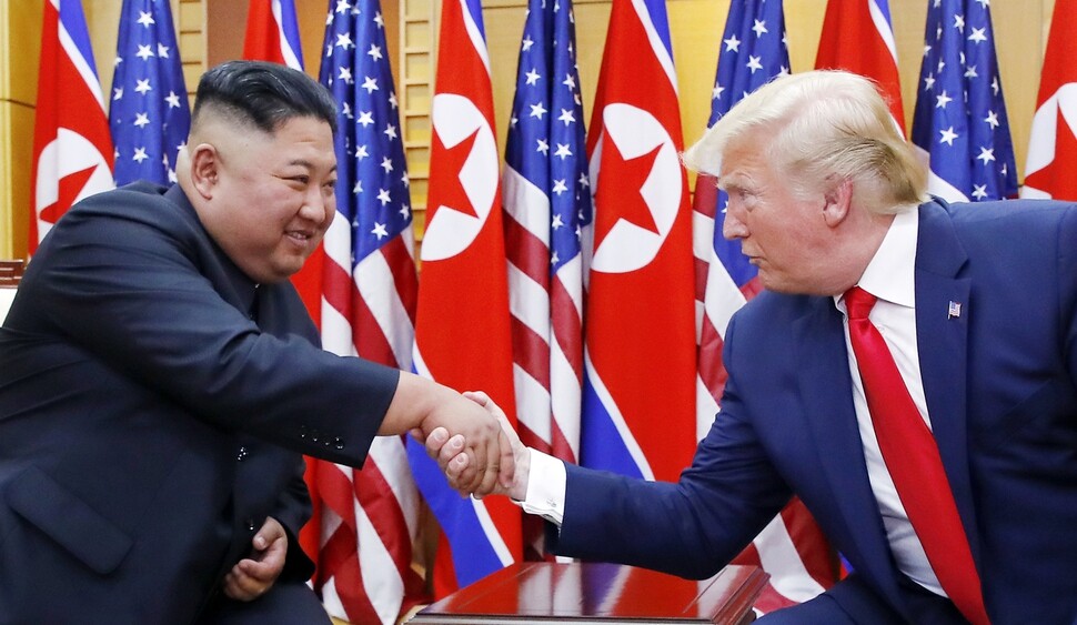 North Korean leader Kim Jong-un and US President Donald Trump shake hands at the House of Freedom in Panmunjom on June 30. (Kim Jung-hyo